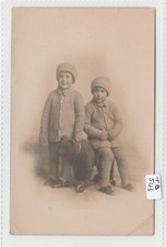 Two children wrapped up in - wrapped,