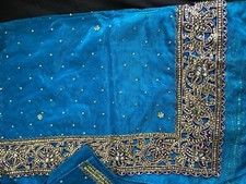 blue/turquoise and gold saree