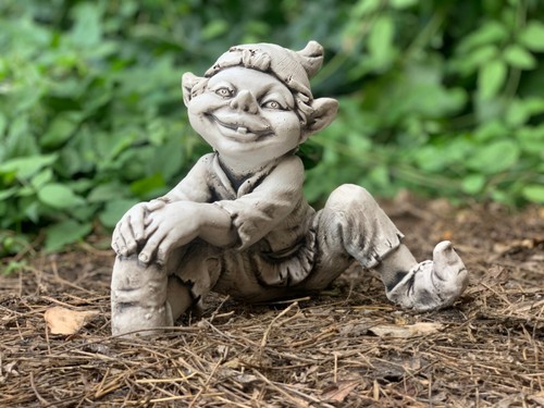 Sitting smiling troll statue