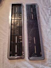 2 x CHROME EFFECT NUMBER PLATE HOLDER SURROUND. 