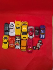 die-cast toy cars, including several Hot Wheels and a car from the movie Cars