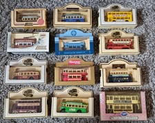 12 Boxed  Lledo & other brands of Bus & Tram Die Cast Models