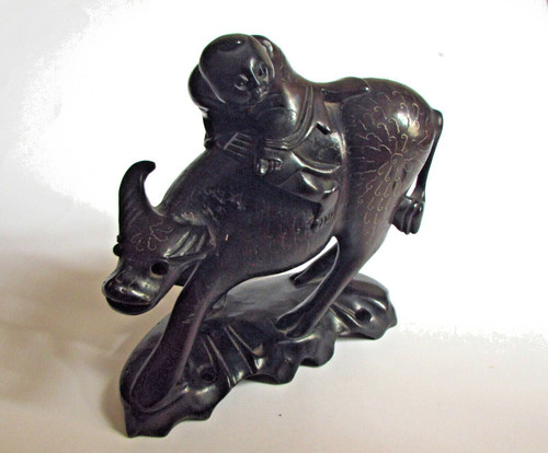 Chinese man and water buffalo - and,