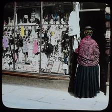WOMAN GOING INTO CLOTHES SHOP