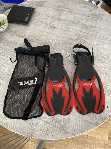Two bare feet snorkelling - two,