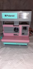 A Vintage Polaroid camera model supercolor Esprit 600 working pink and grey