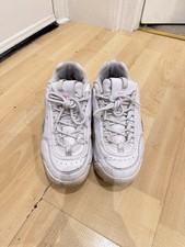 White FILA trainers