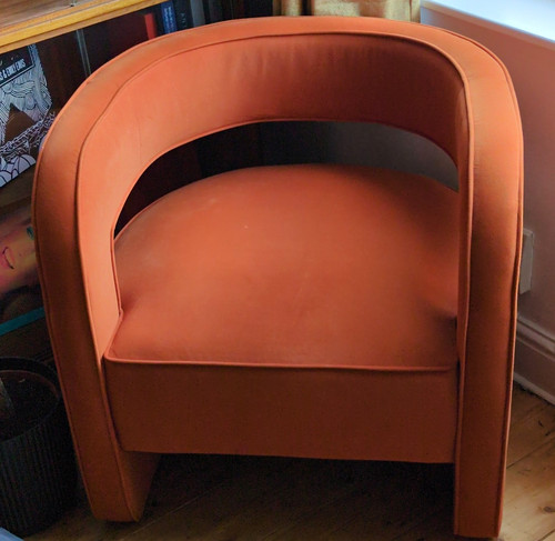 Orange leather upholstered tub - upholstered,