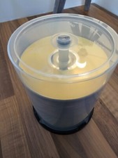 A stack of unused blank recordable DVDs (~35x) and CDs (~45x)