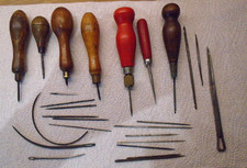 Vintage leatherworking awls, hooks, bradawls and a variety of needles.