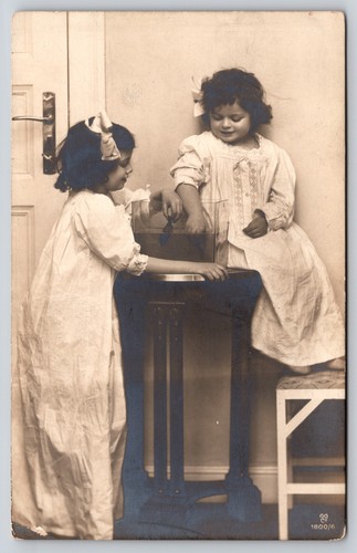 Postcard rppc girls holding - rppc,