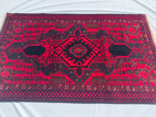 Red geometric hand knotted - hand,