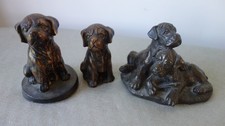 Three very cute, bronze effect boxer puppy ornaments