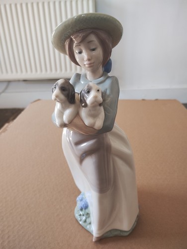 Lladro nao girl holding dogs - holding,