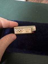 This is a Barcelona 1992 Olympics souvenir lighter.