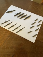 A collection of 18 WWI Crescent Toys cast metal ships and submarines.