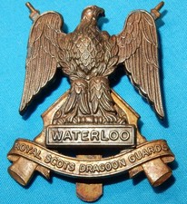 ROYAL SCOTS DRAGOON GUARDS REGIMENT BRITISH MILITARY CAP BADGE BI-METAL