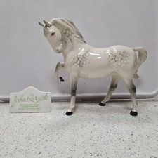 Beswick head tucked down Stallion figurine, model number 1549  in a dapple grey