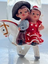 Vintage Spanish Mud People Male and Female figures riding on a horse and girl