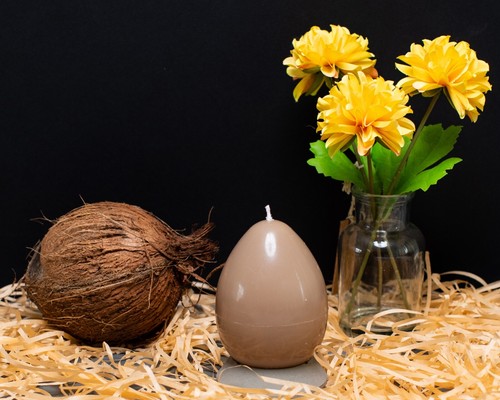 Egg shaped pillar candle with - shaped,