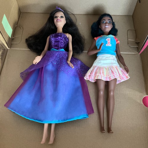 Two barbie dolls - two,