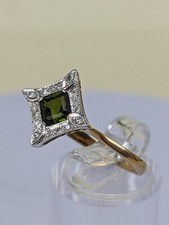 Green garnet stone with surrounding diamonds in the medieval style Uk size : R+