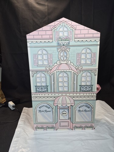 Cardboard doll house has - cardboard,