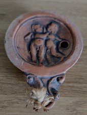Antique Roman Pottery Oil Lamp depicting cherubs