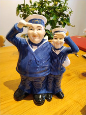 AN UNUSUAL POTTERY LAUREL AND HARDY TOILET BRUSH HOLDER SAILOR UNIFORM HMS