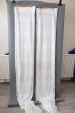 Pair cream lace  net curtains with tassle fringing approx 62" x 90"