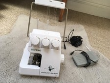 Sewland Sew Land overlock serger sewing machine Works But for spares or repair.