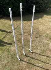 White plastic fence pin posts