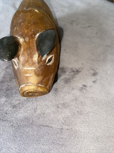 Hand calved wooden pig - hand,