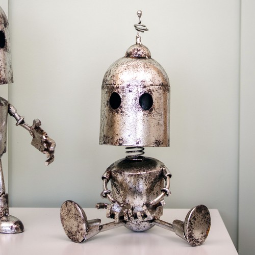 Vintage sitting metal robot - sitting,