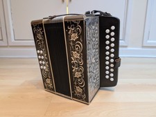 Weltmeister D - G Black and silver button accordion