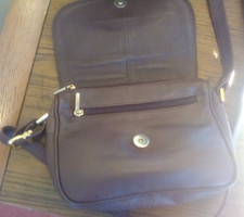 Enny brown leather bag, flapover front, 48 inch strap, 8.5 x 6  great condition