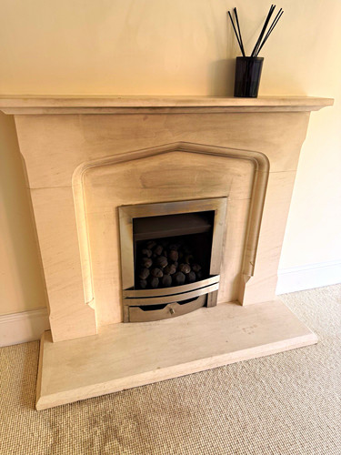 Beige stone fireplace - stone,