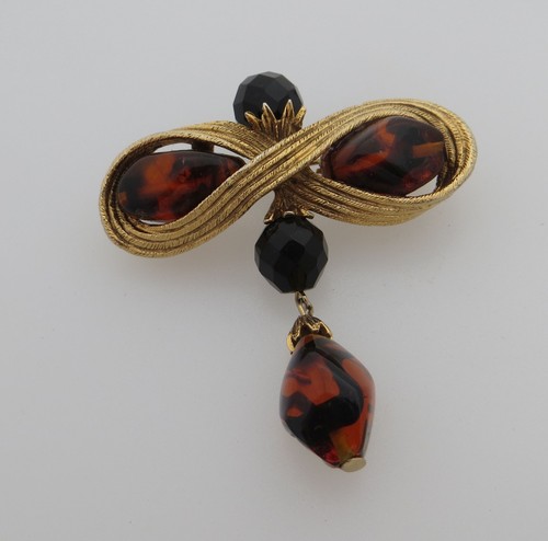 Gold tone metal - tone, bow