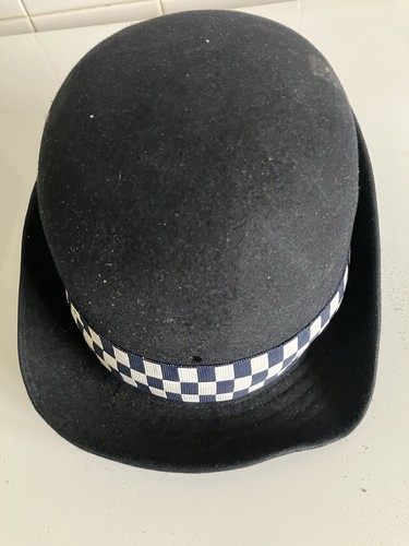 Obsolete female police bowler - female,