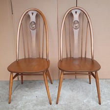 PAIR OF ERCOL  SWAN CHAIRS IN