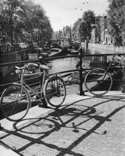 Bicycles and barges on a canal in Amsterdam 1960s Old Historic Photo