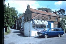 35mm Slide Mk 1 Ford Escort Estate outside country shop 1977