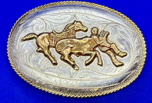 Cowboy horseback chasing calf - horseback,