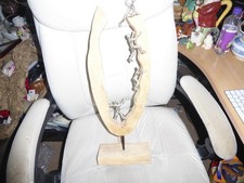 Wooden sculptor men climbing