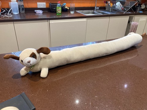 Cream dog shaped draught - dog,