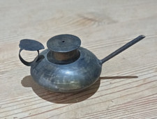 Small brass finger held oil