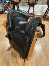ZALDI Alta Escuela High School dressage saddle with a sheepskin cover.