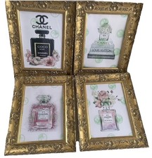 Four Gold Framed Chanel Art
