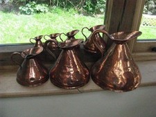Victorian 7 x graduated Haystack copper jugs 1 gallon to 1/2 Gill lead seal
