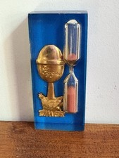 3 Minutes Egg Timer In lucite With Gold Spoon With Chicken On It Blue Background